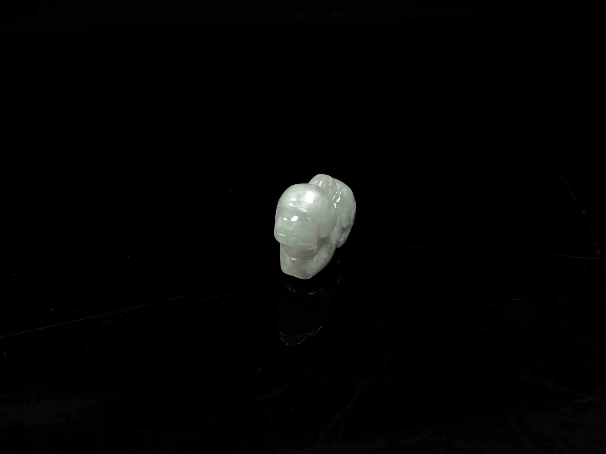 A translucent pale white dog loose jadeite.