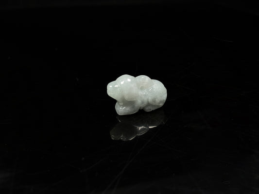 A translucent pale white dog loose jadeite.