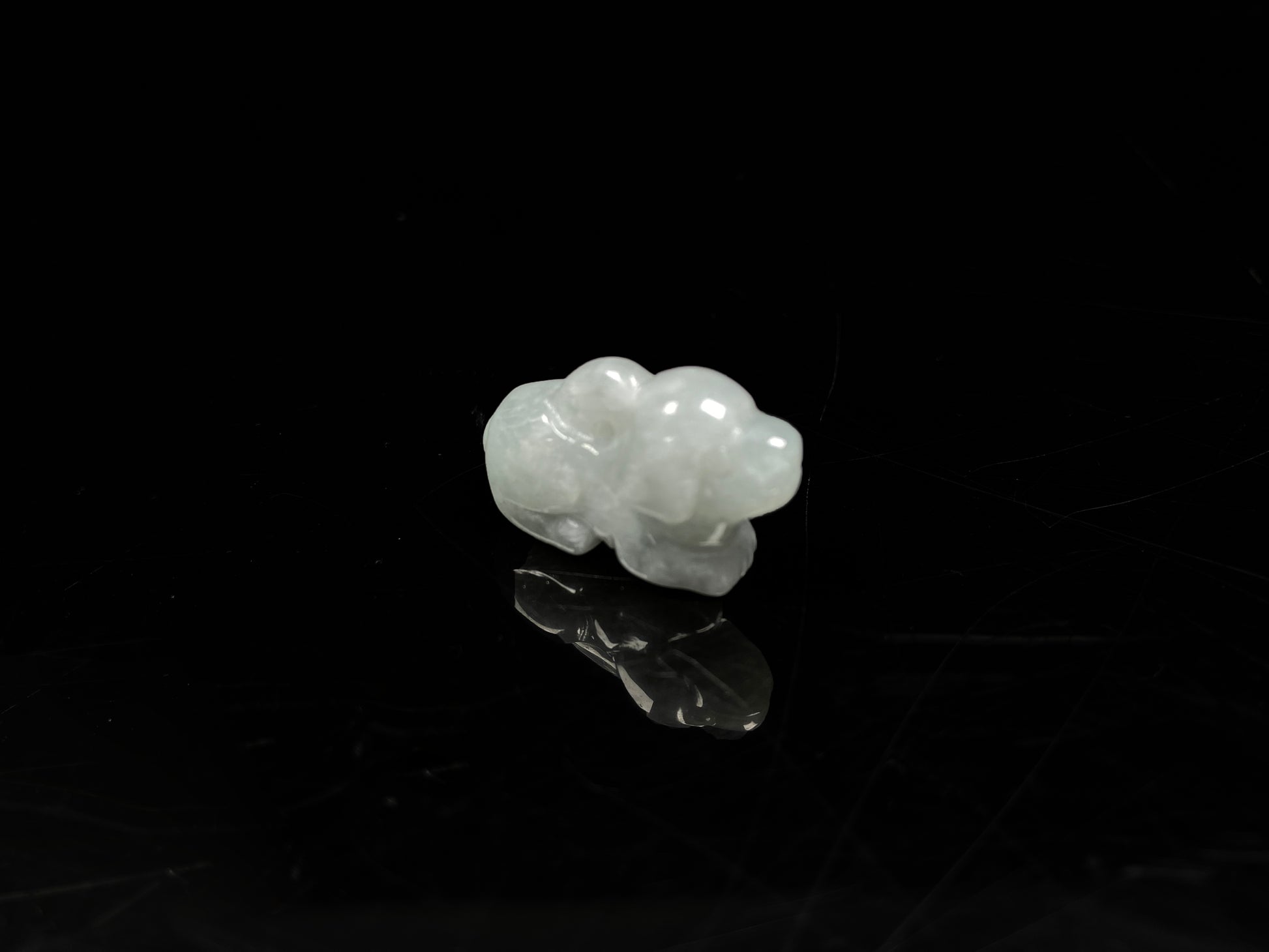 A translucent pale white dog loose jadeite.