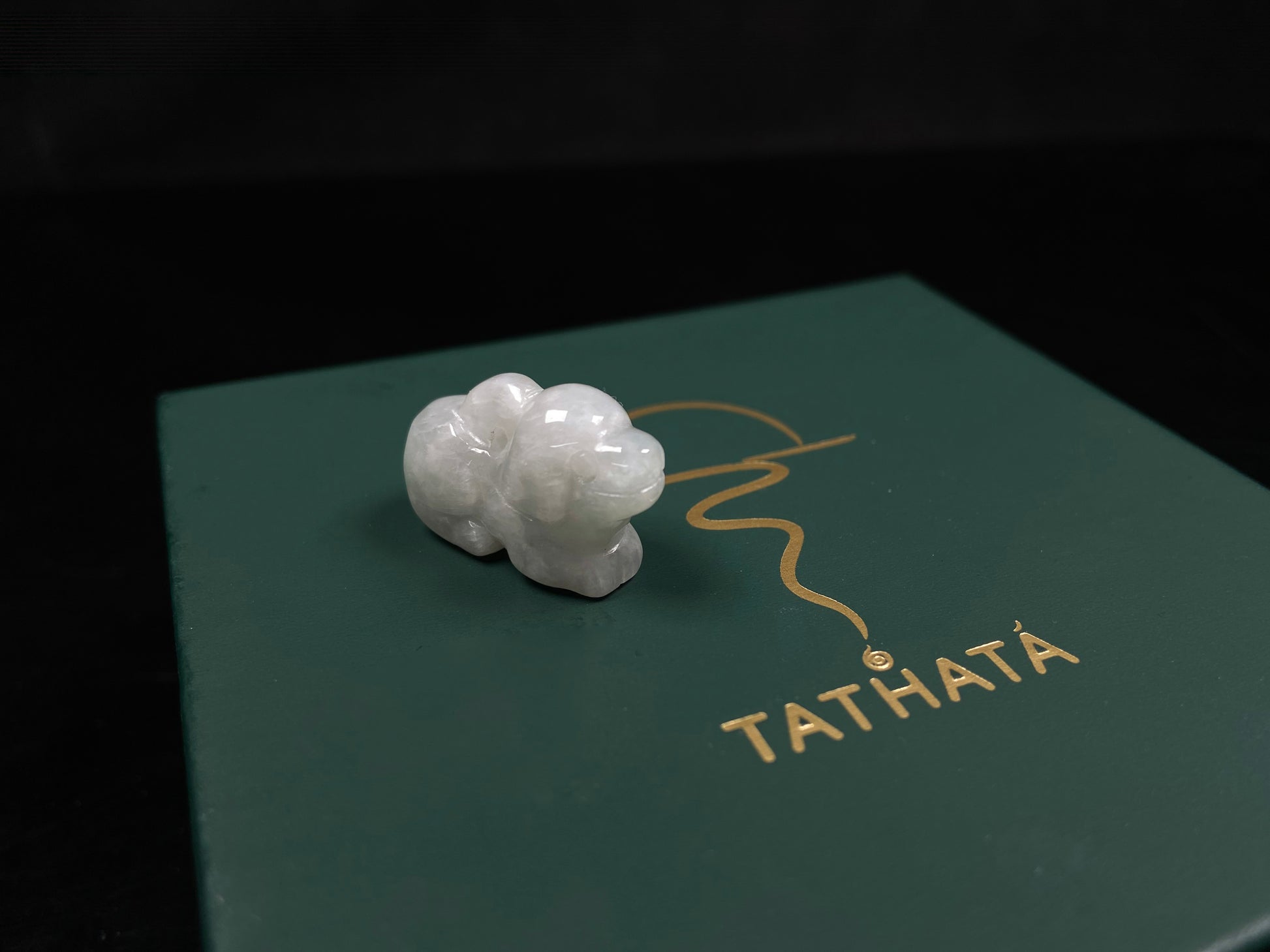 A translucent pale white dog loose jadeite.