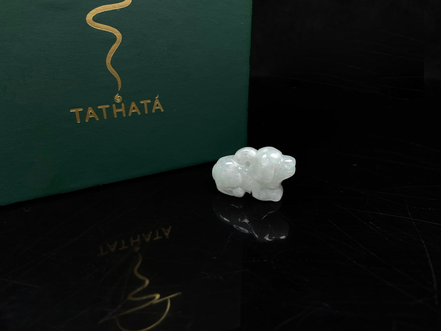 A translucent pale white dog loose jadeite.