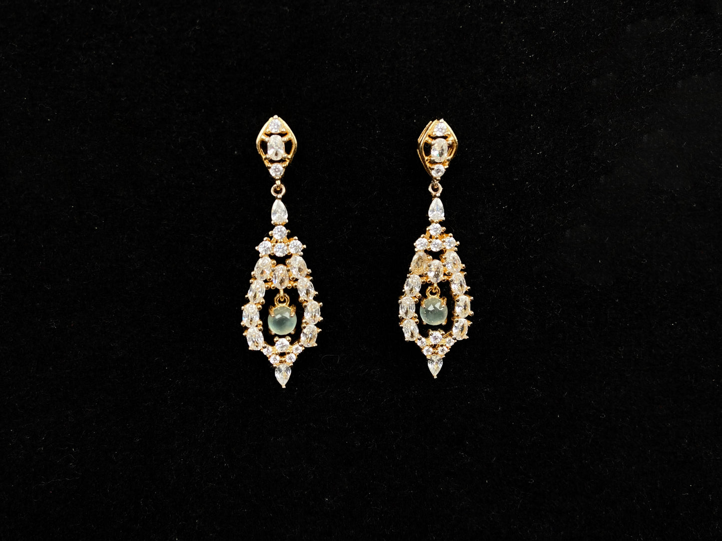 A  pair of diamond halo clear teardrop jadeite earrings.