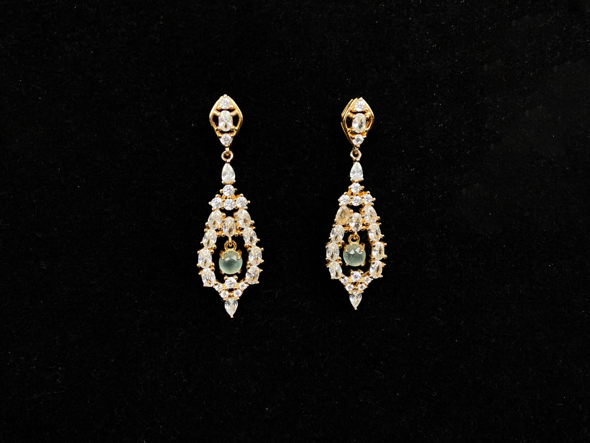 A  pair of diamond halo clear teardrop jadeite earrings.