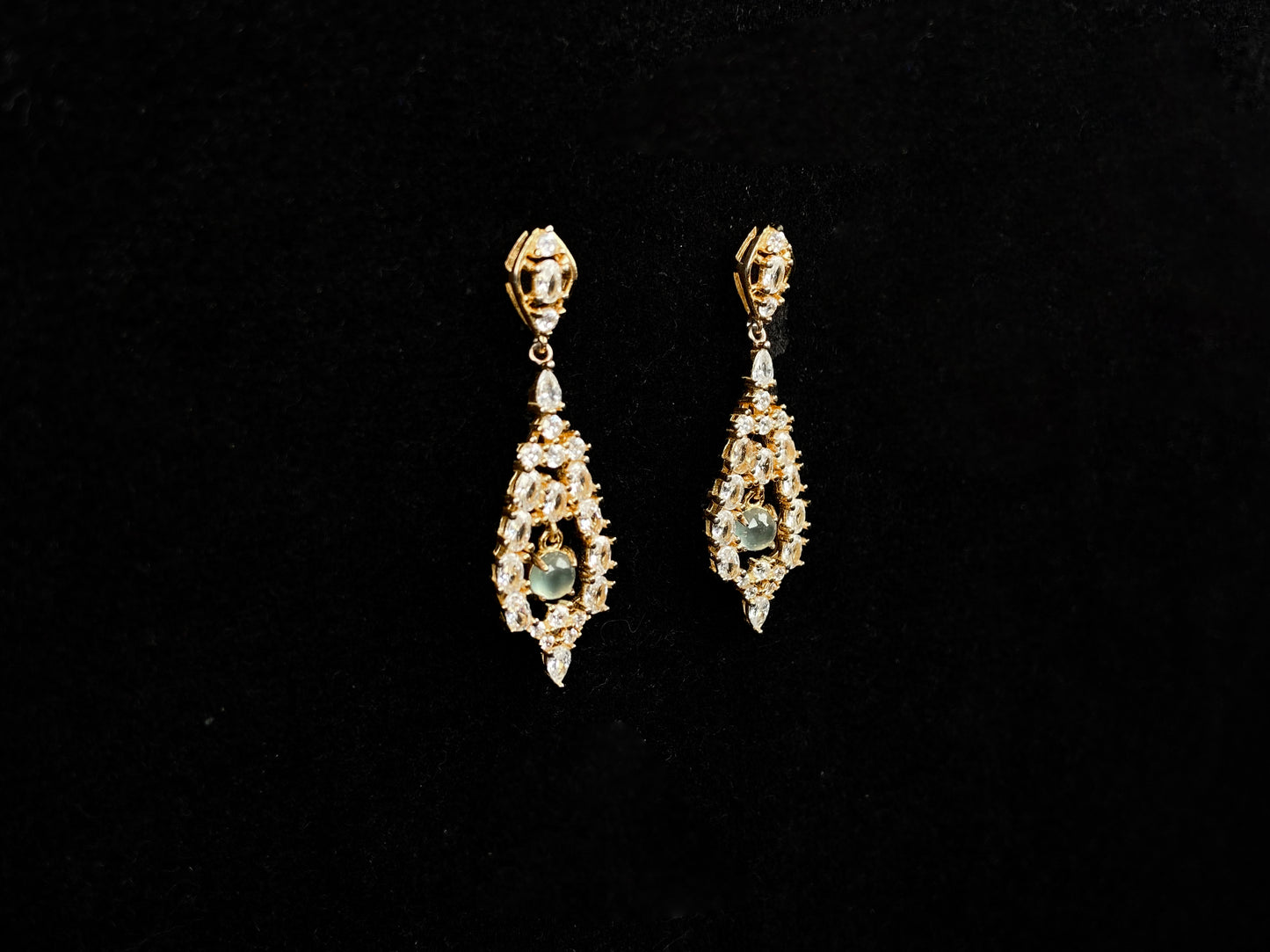 A  pair of diamond halo clear teardrop jadeite earrings.