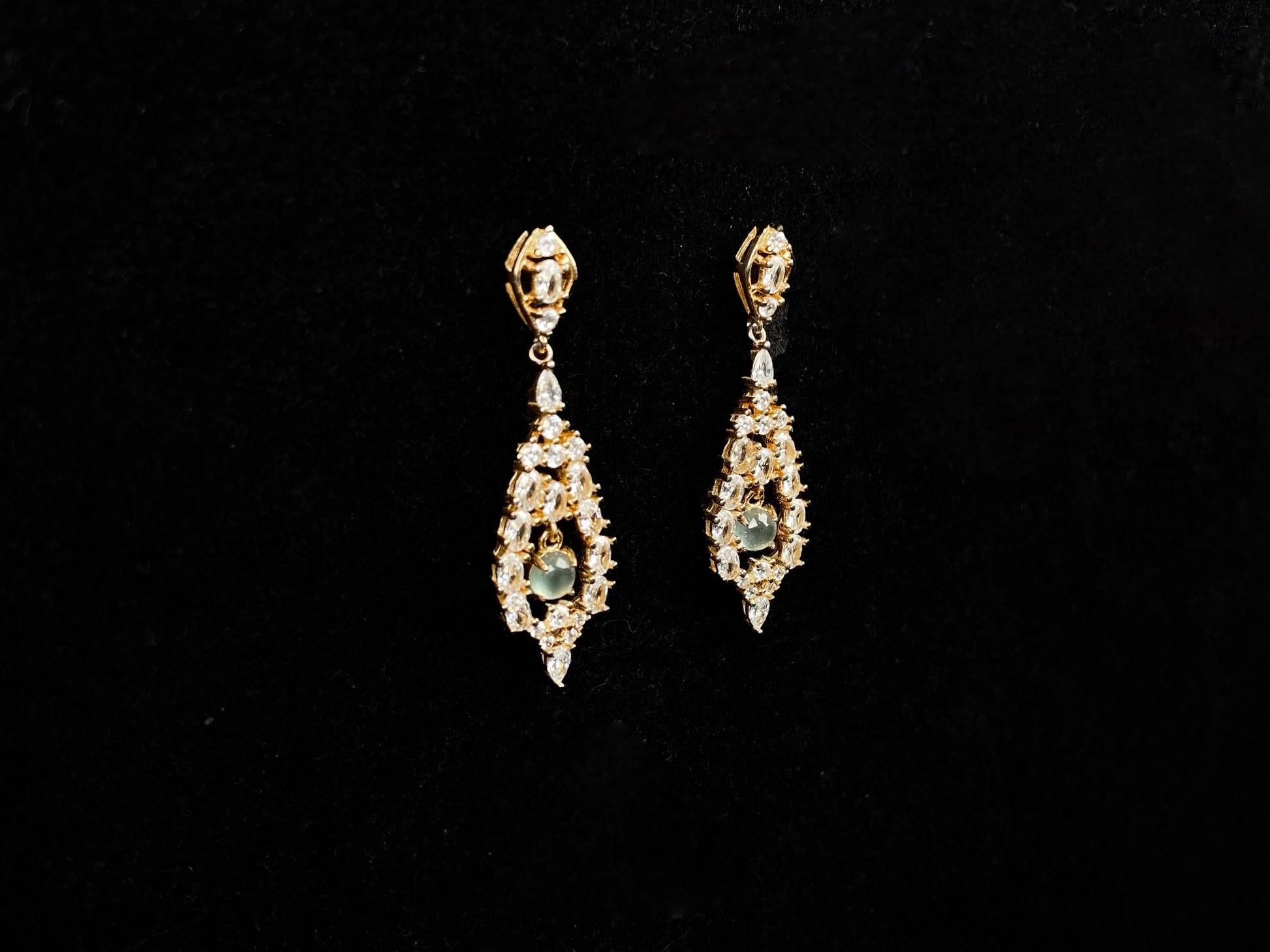 A  pair of diamond halo clear teardrop jadeite earrings.