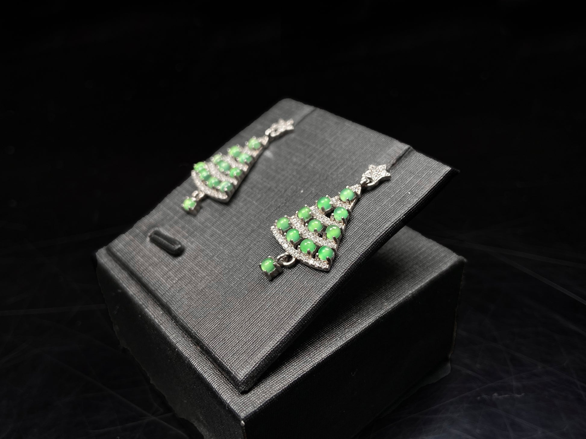 A pair of lucky green christmas tree jadeite earrings.