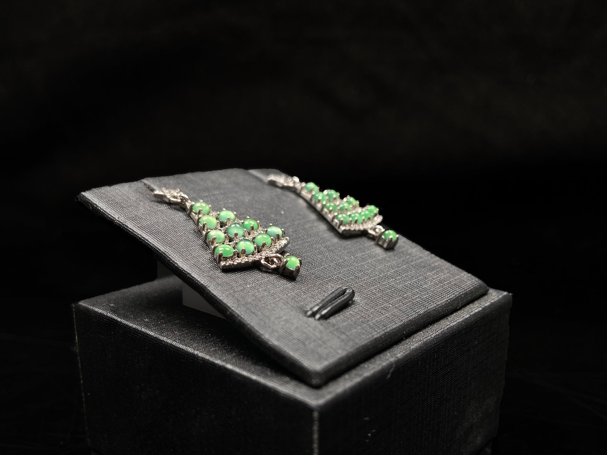 A pair of lucky green christmas tree jadeite earrings.