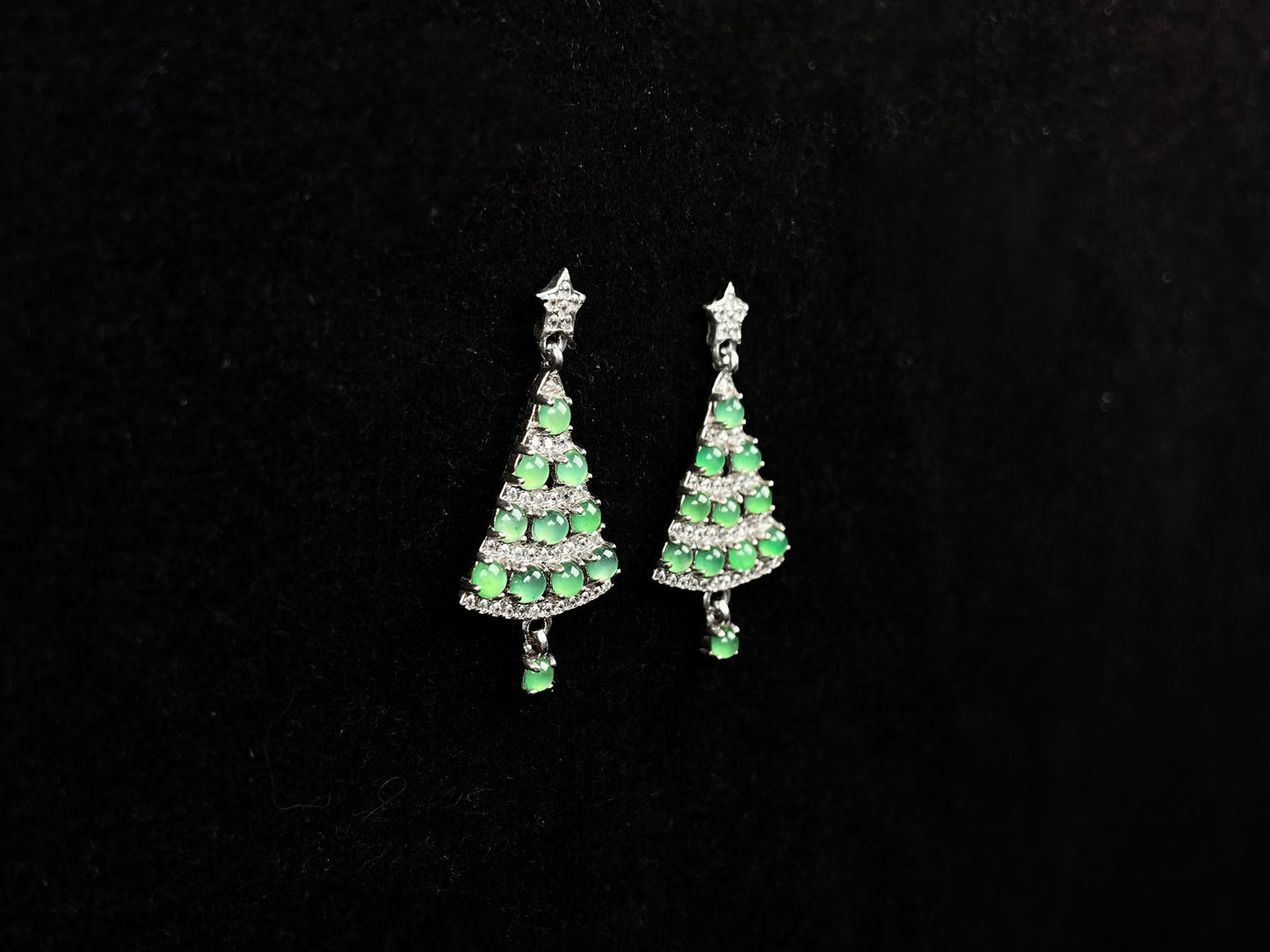 A pair of lucky green christmas tree jadeite earrings.