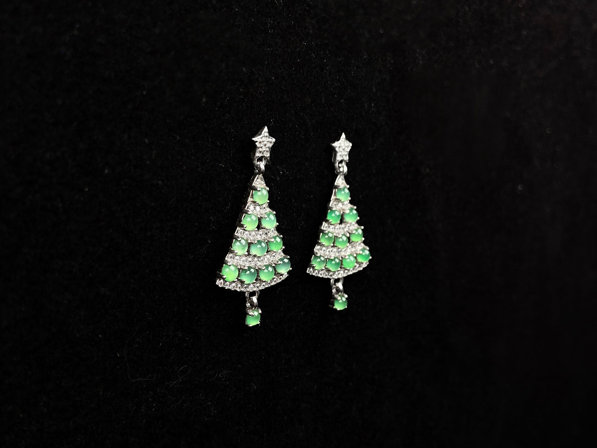 A pair of lucky green christmas tree jadeite earrings.