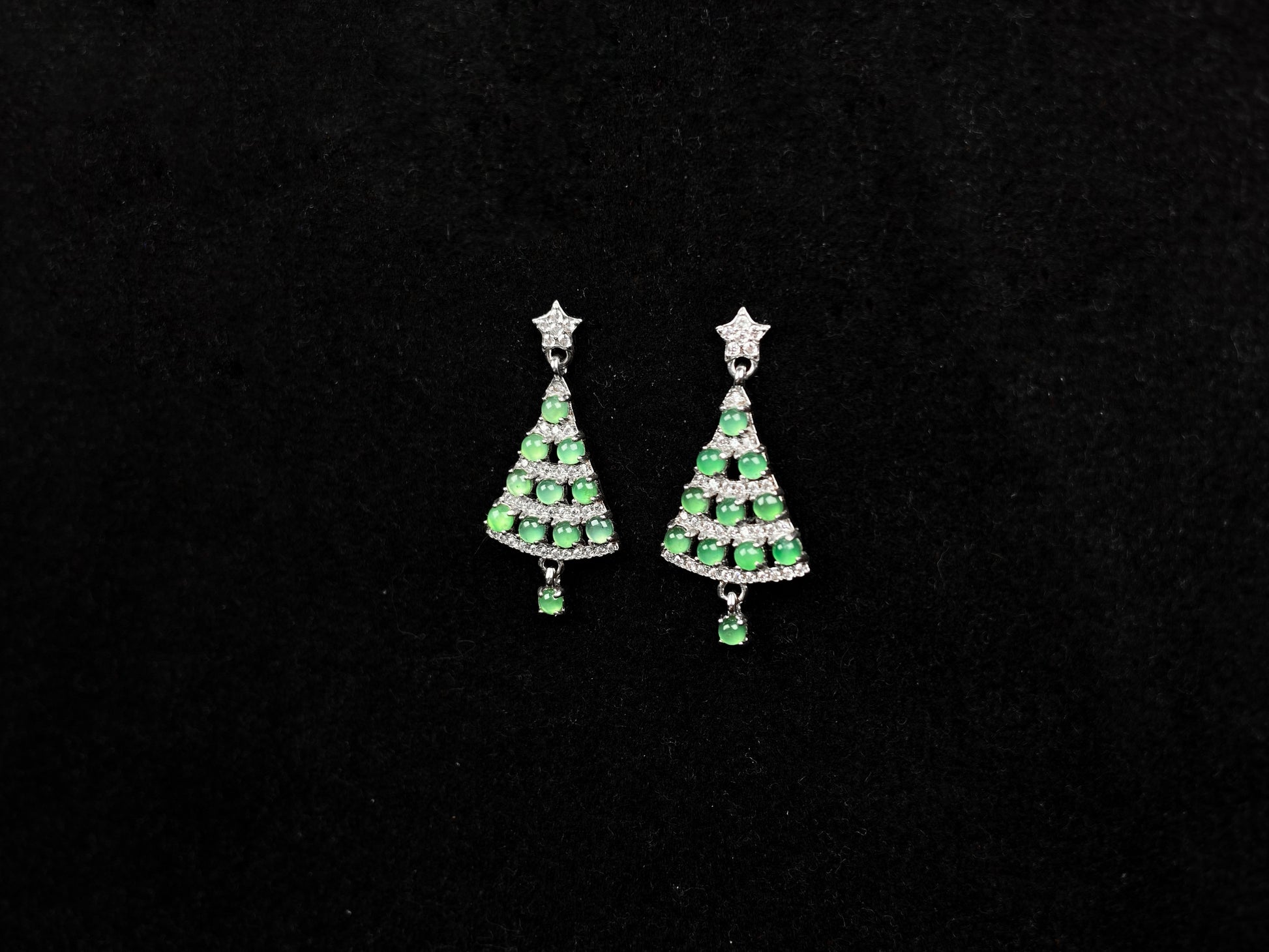 A pair of lucky green christmas tree jadeite earrings.