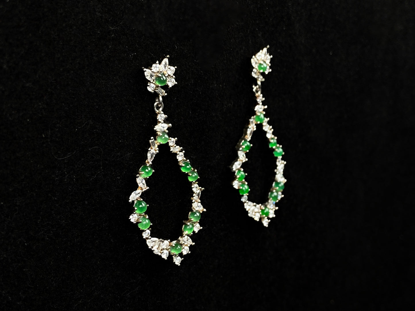 A green teardrop garland jadeite earrings.
