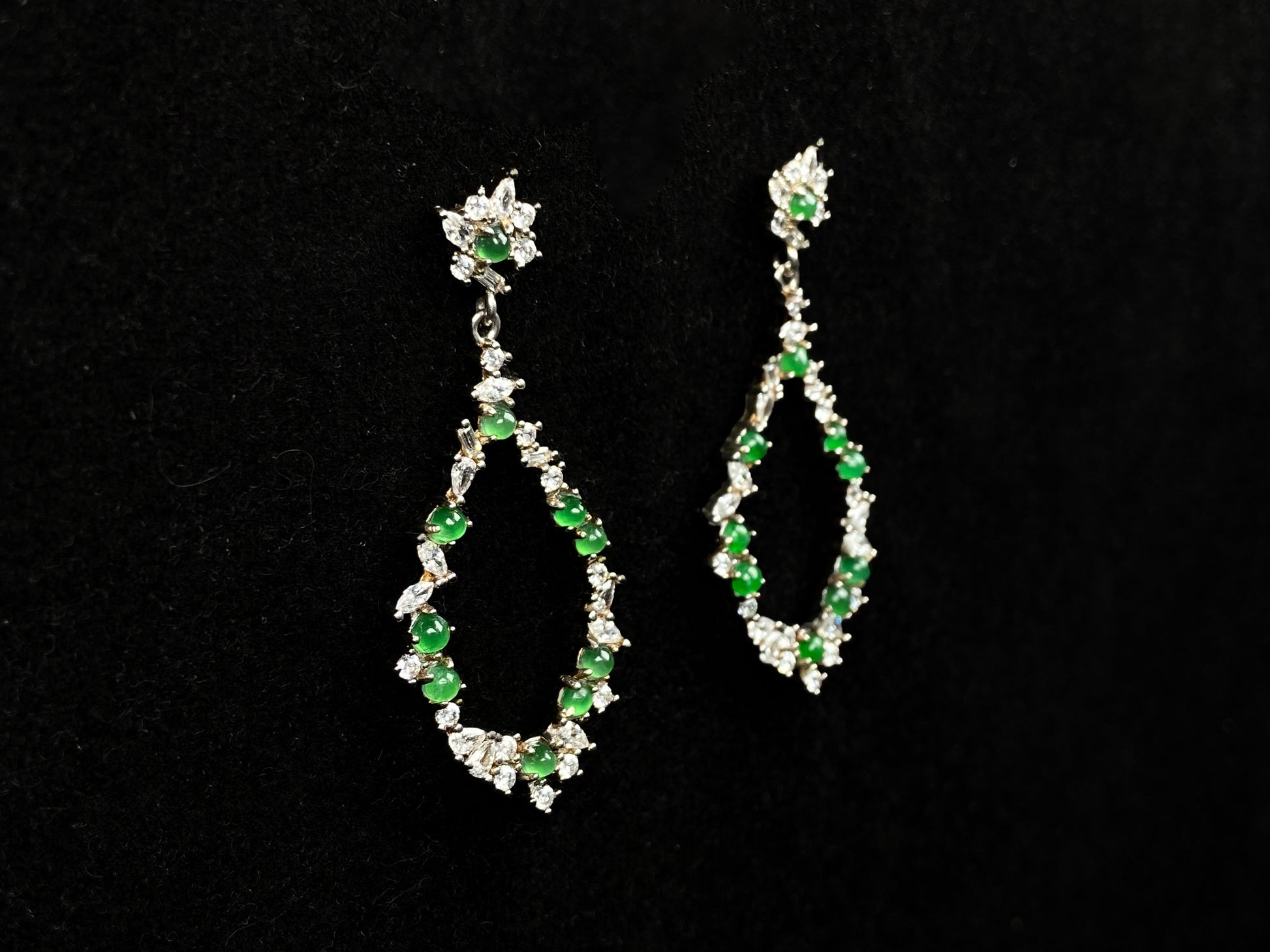 A green teardrop garland jadeite earrings.