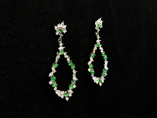 A green teardrop garland jadeite earrings.