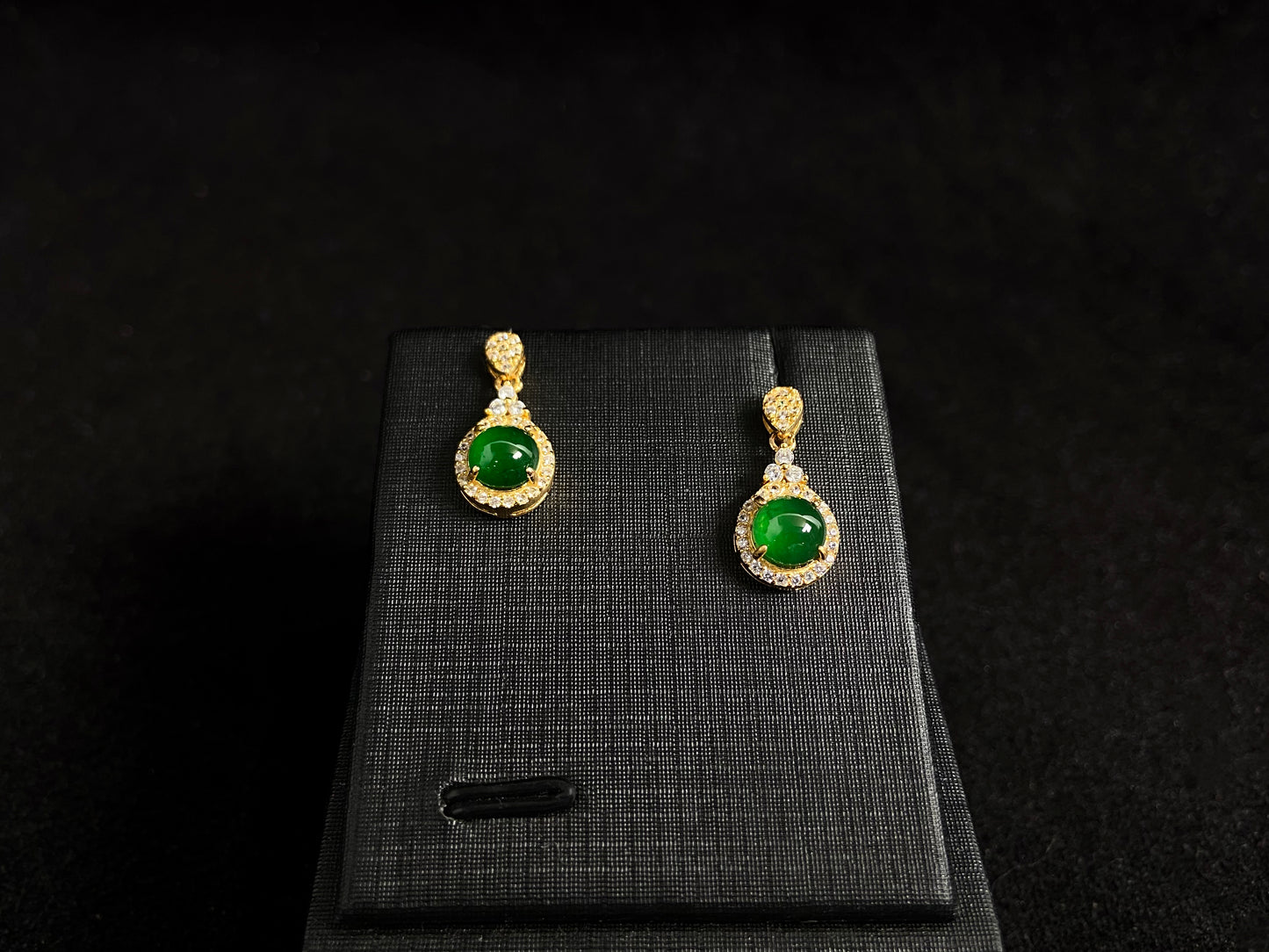 Imperial green jade beads set in gold plated silver with secure prong settings.