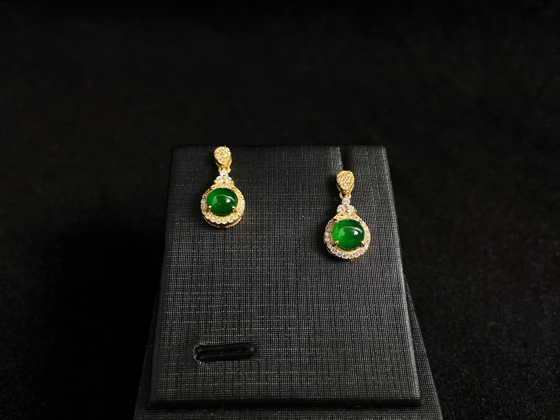 Imperial green jade beads set in gold plated silver with secure prong settings.