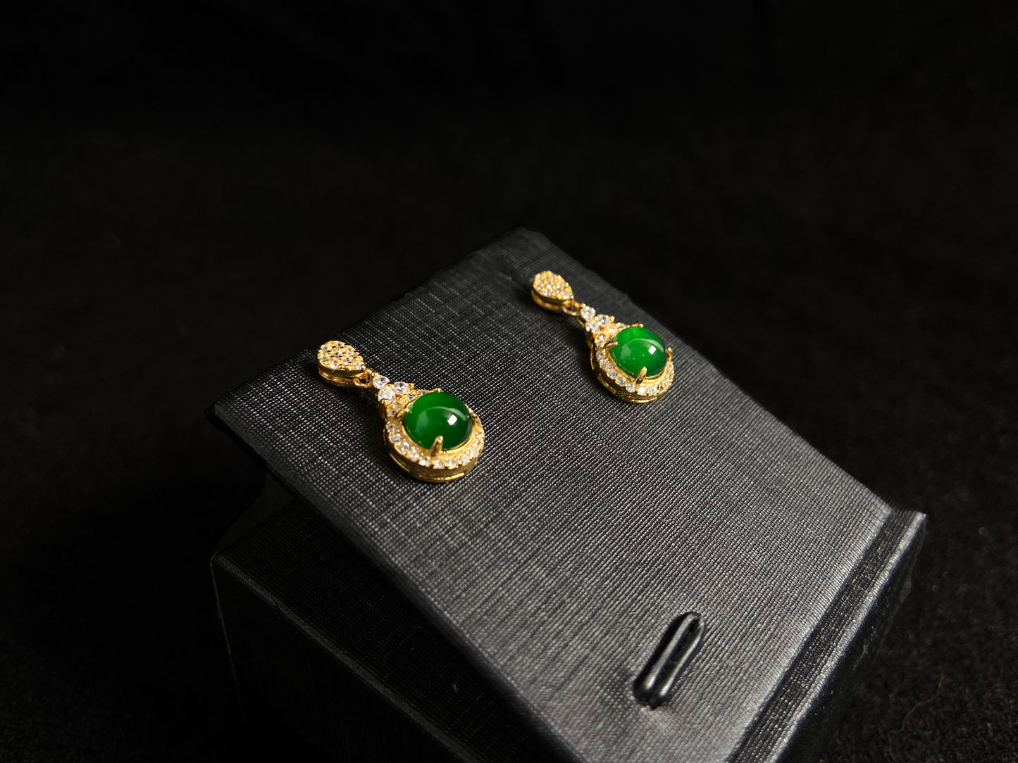 Imperial green jade beads set in gold plated silver with secure prong settings.