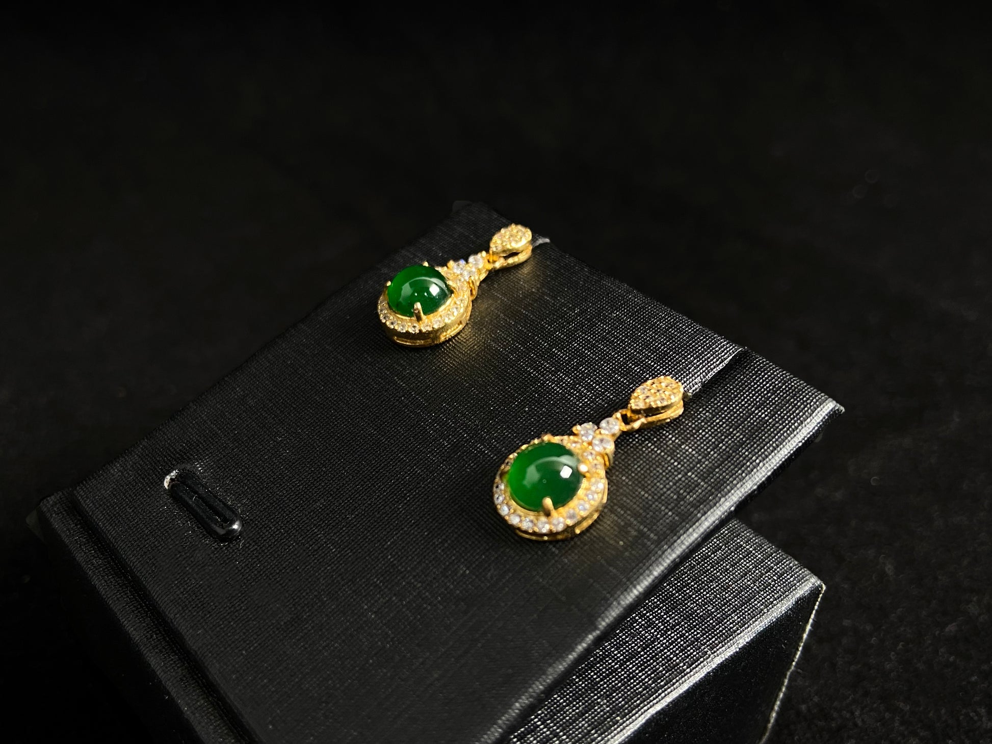 Imperial green jade beads set in gold plated silver with secure prong settings.