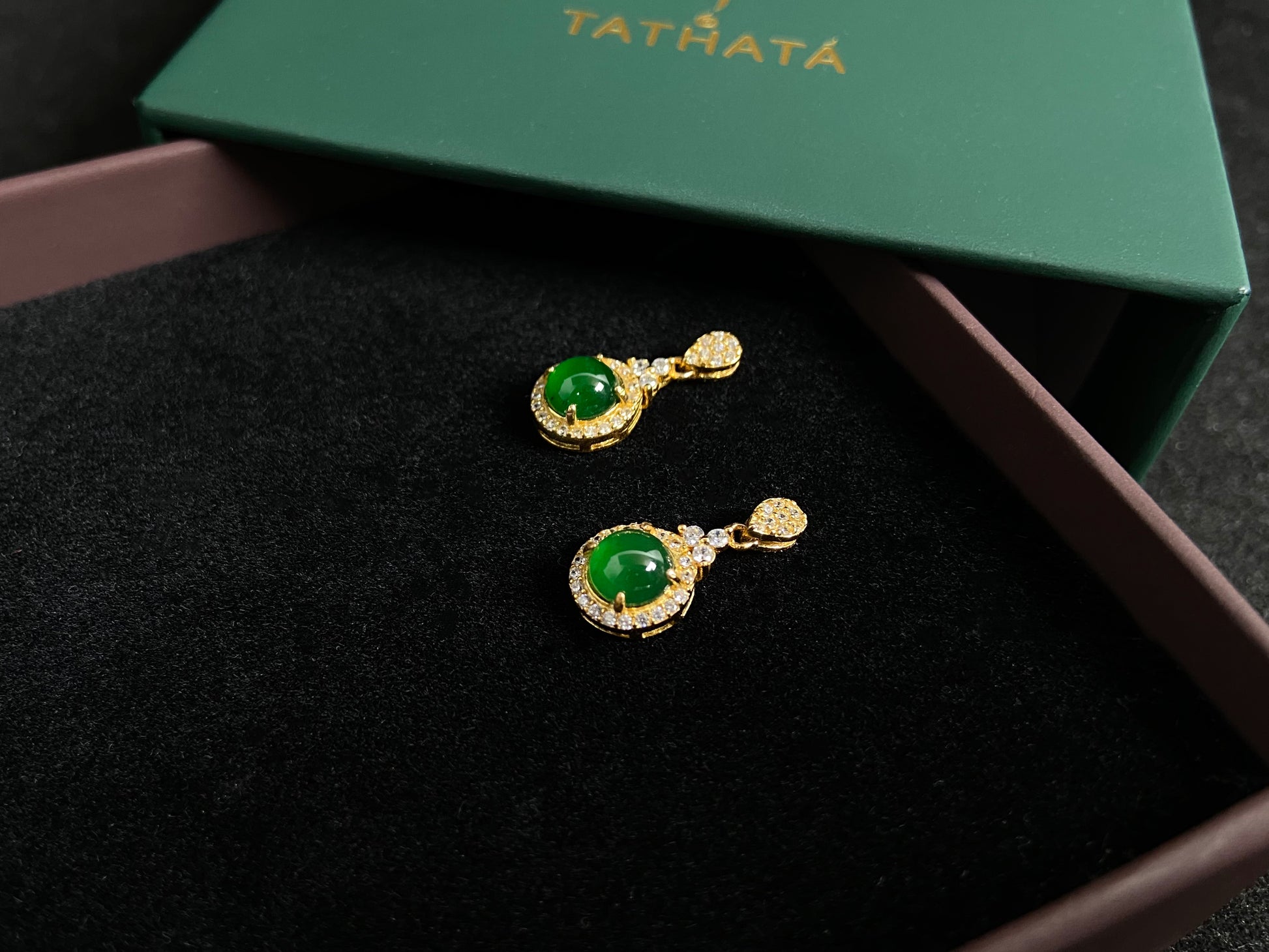 Imperial green jade beads set in gold plated silver with secure prong settings.