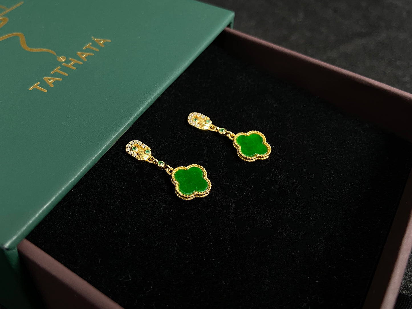 These elegant earrings feature bean green jadeite four leaf clovers, each beautifully framed in gold plated 925 silver.