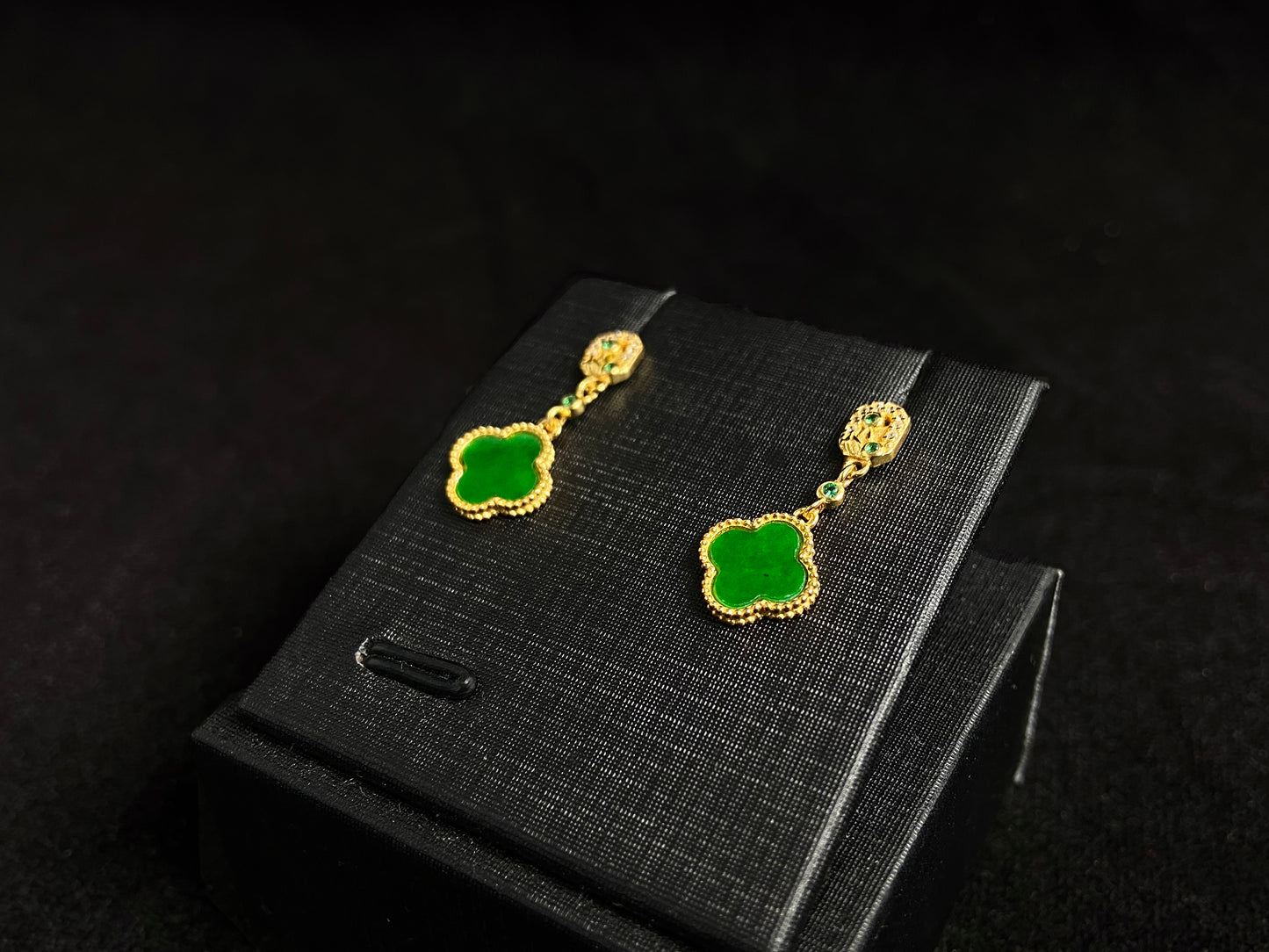 These elegant earrings feature bean green jadeite four leaf clovers, each beautifully framed in gold plated 925 silver.