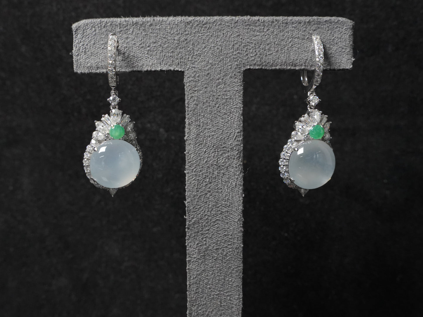 Icy moon drop green accent jadeite earrings.