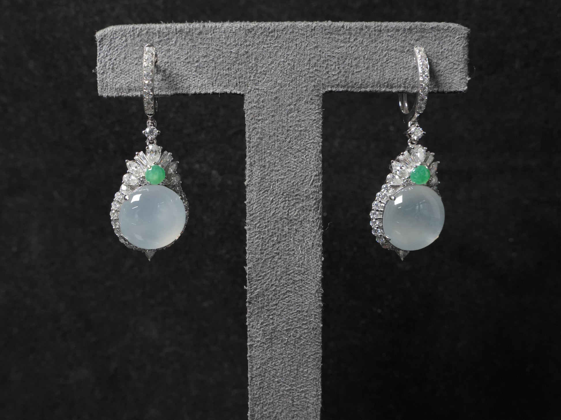 Icy moon drop green accent jadeite earrings.