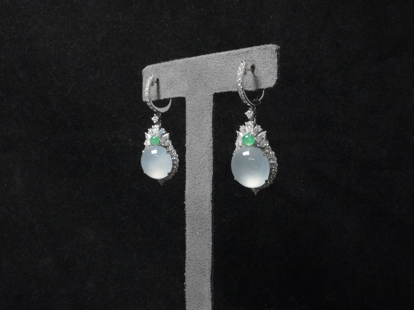 Icy moon drop green accent jadeite earrings.