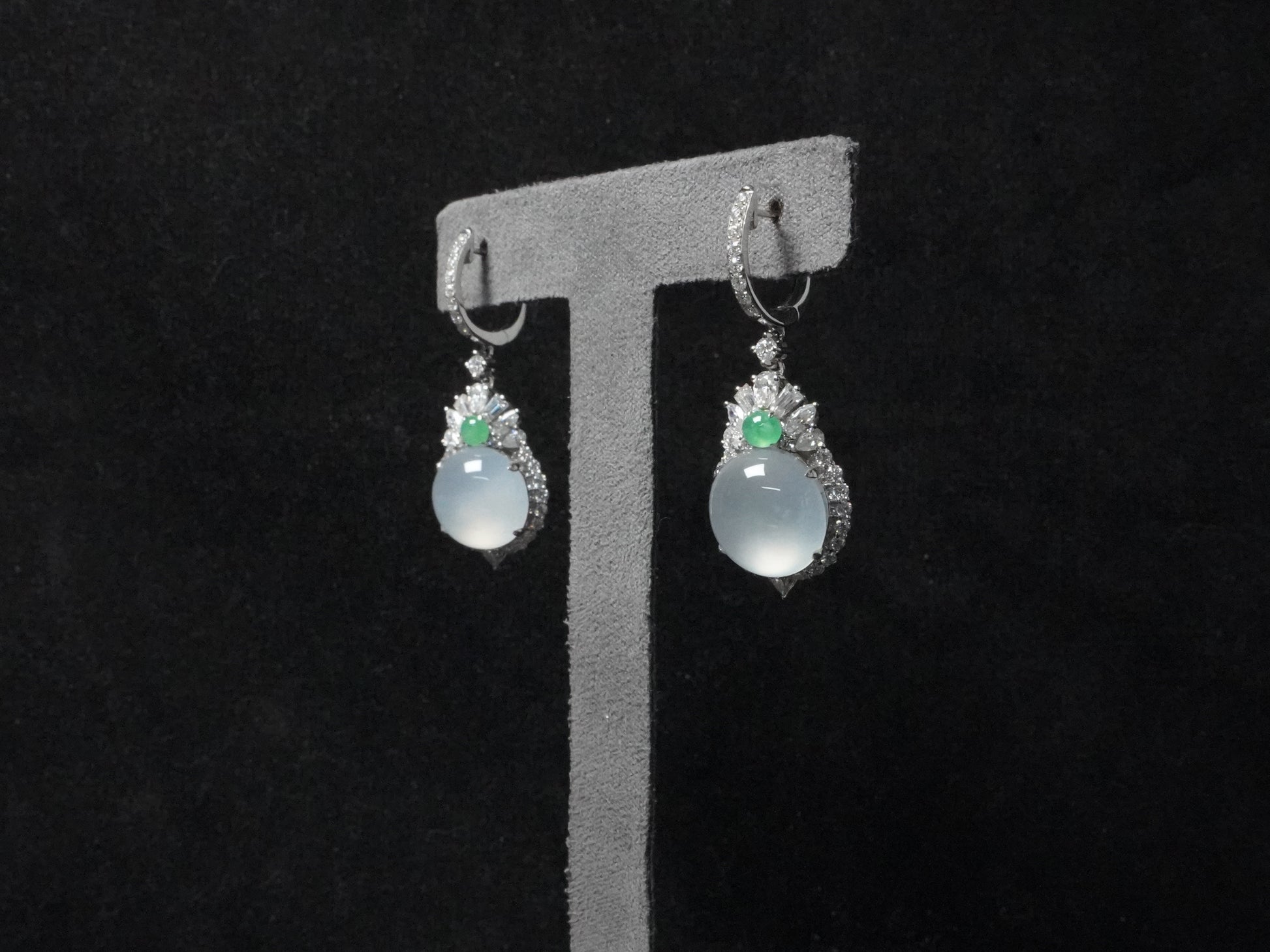 Icy moon drop green accent jadeite earrings.