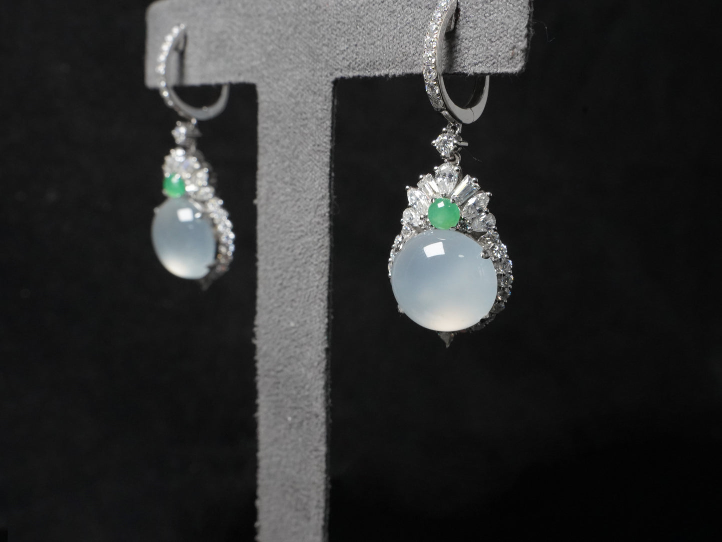 Icy moon drop green accent jadeite earrings.