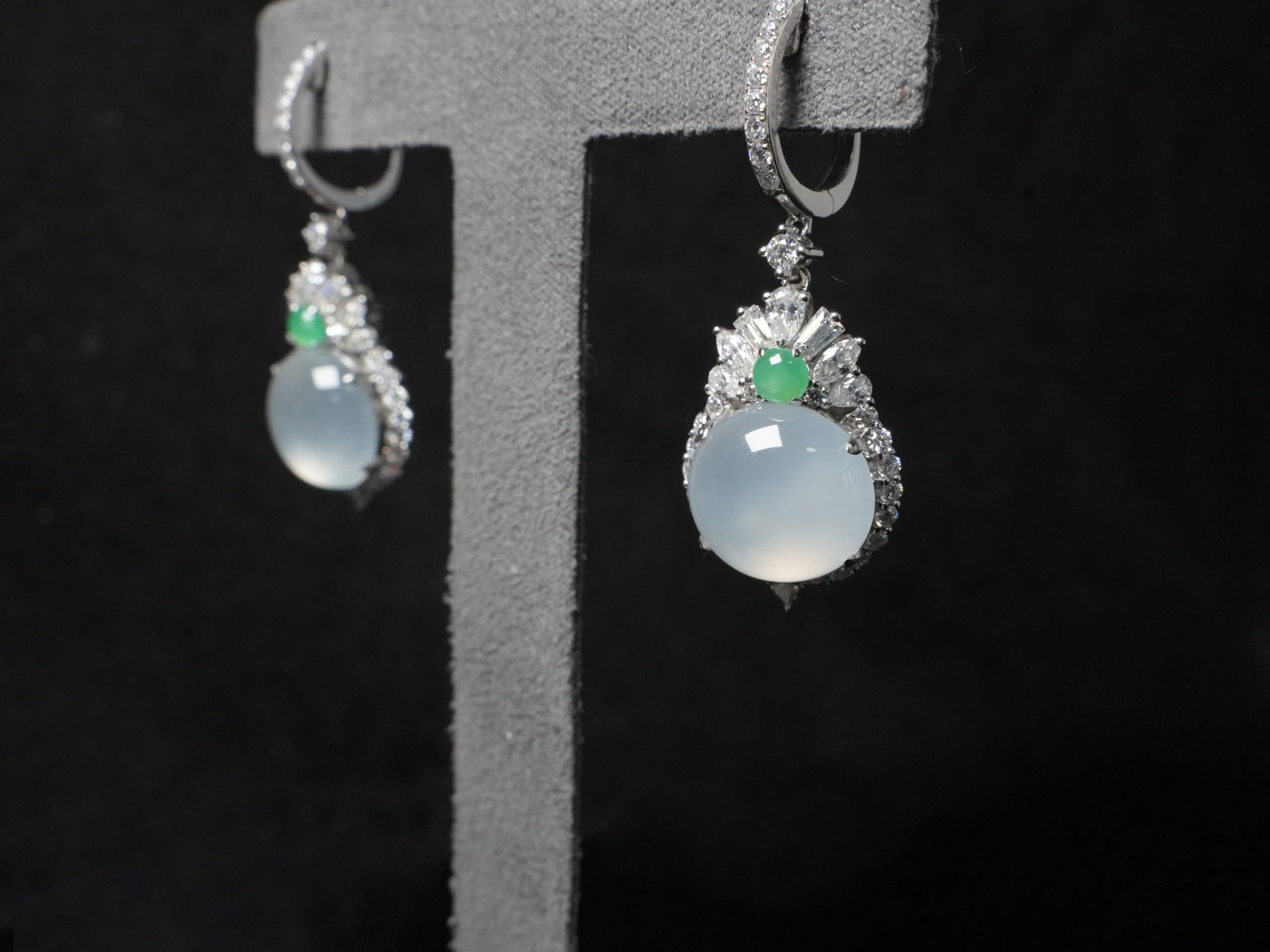Icy moon drop green accent jadeite earrings.
