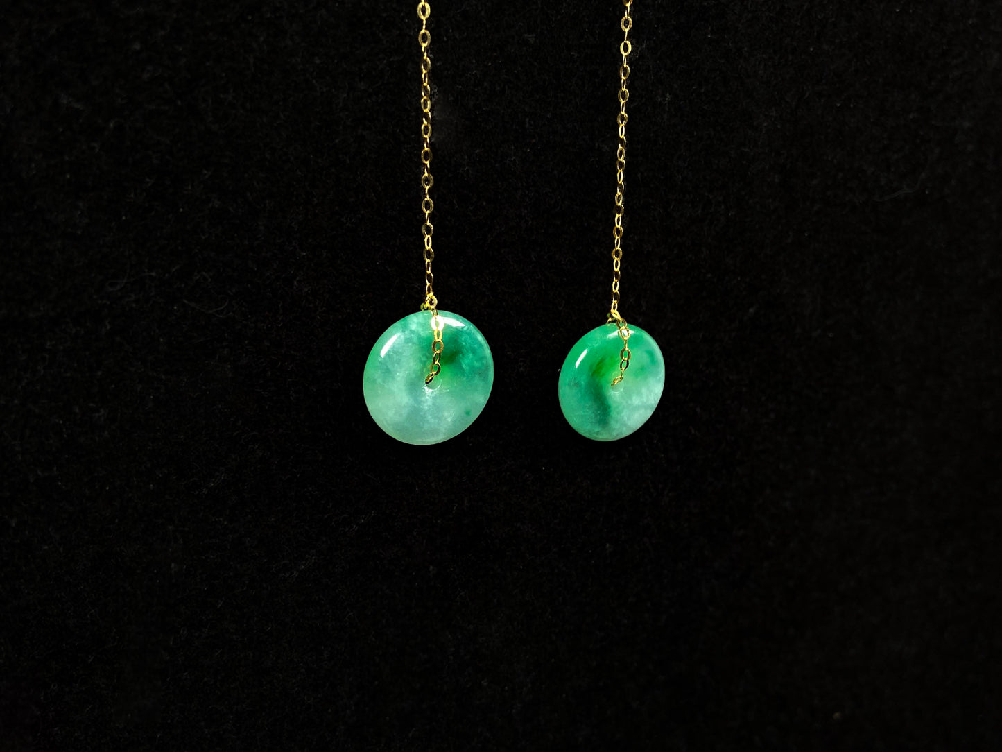A peaceful green Ping An Kou jadeite earring.