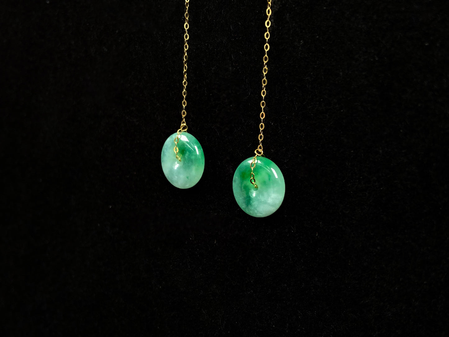 A peaceful green Ping An Kou jadeite earring.