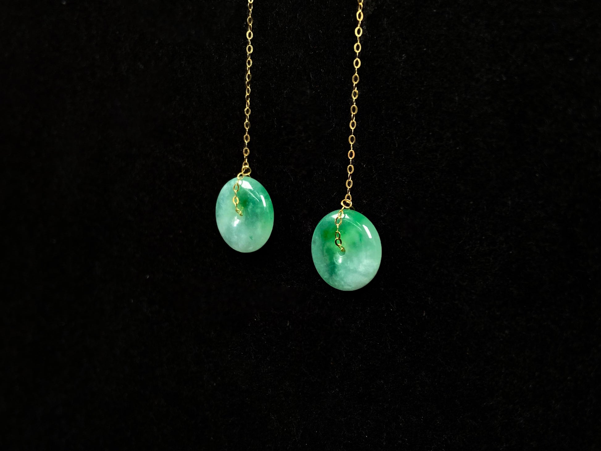A peaceful green Ping An Kou jadeite earring.