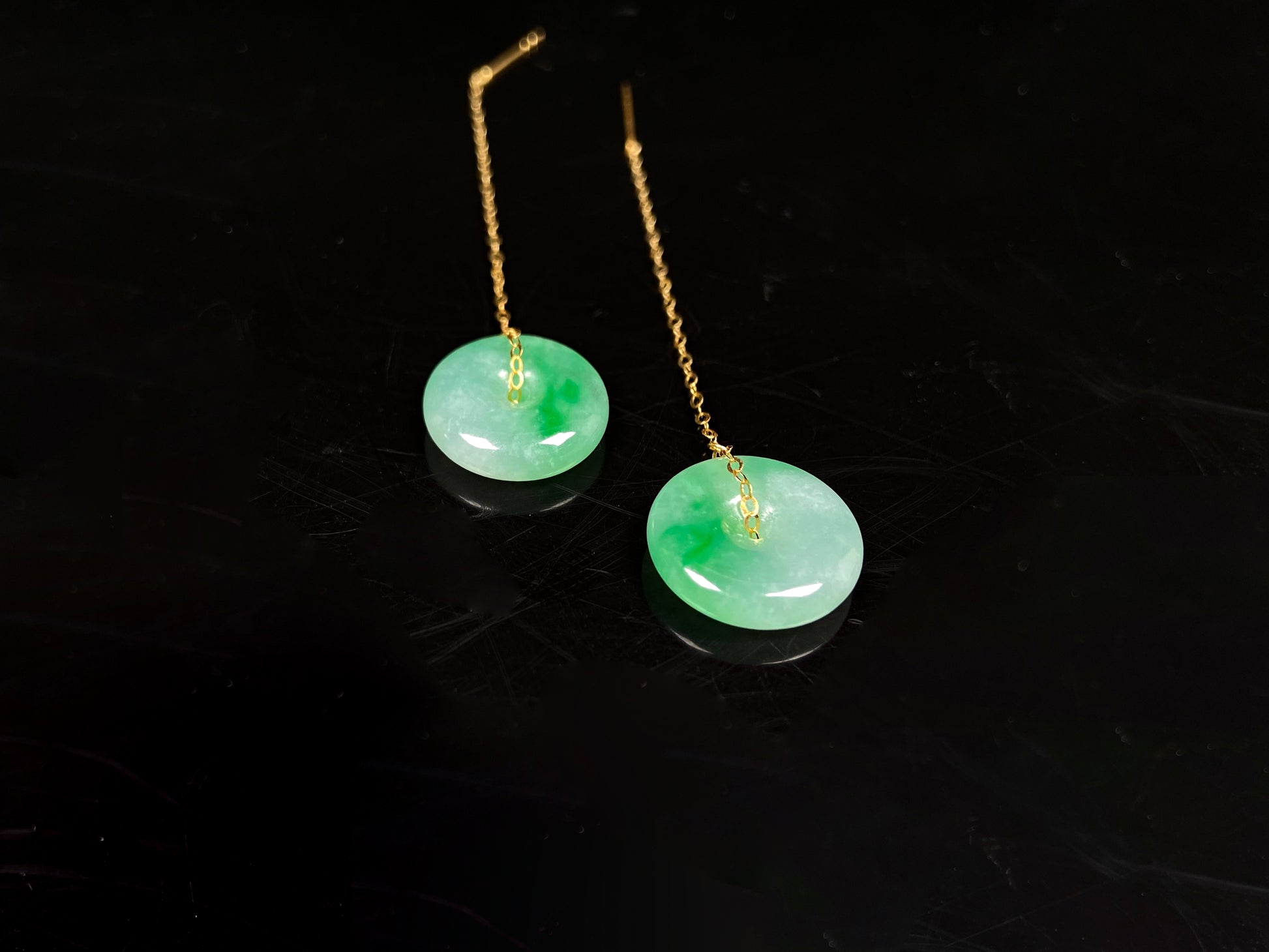 A peaceful green Ping An Kou jadeite earring.
