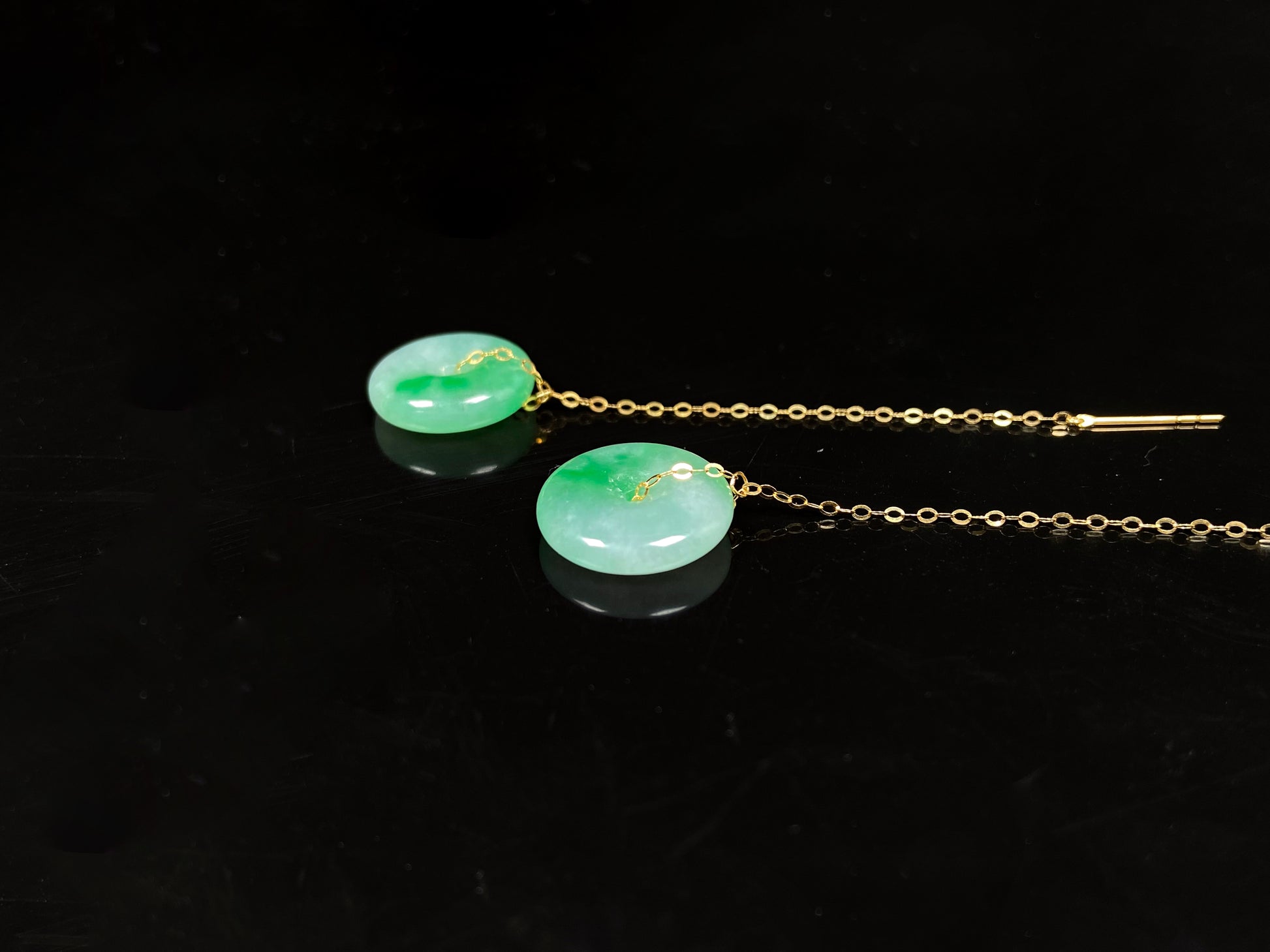 A peaceful green Ping An Kou jadeite earring.