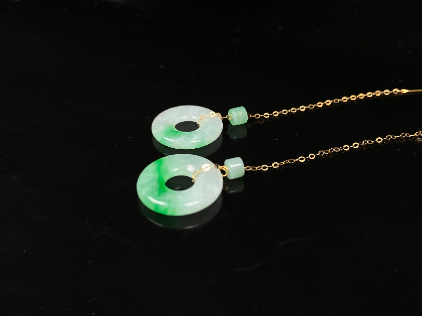 A milky white green cloud donut jadeite earring.