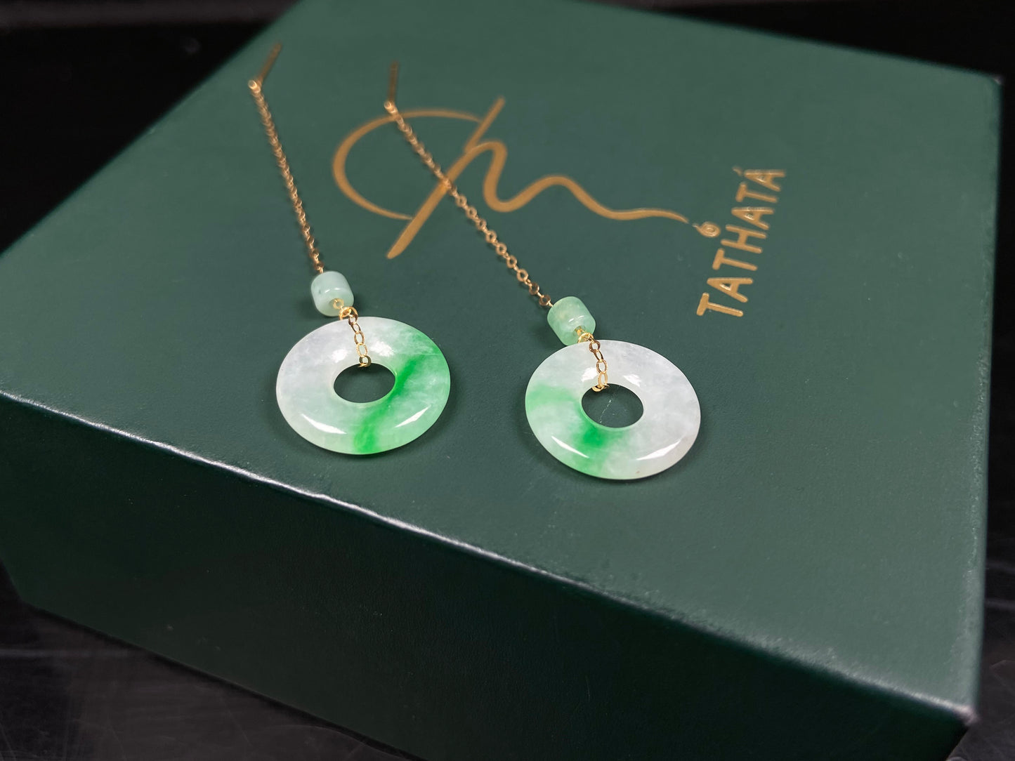 A milky white green cloud donut jadeite earring.