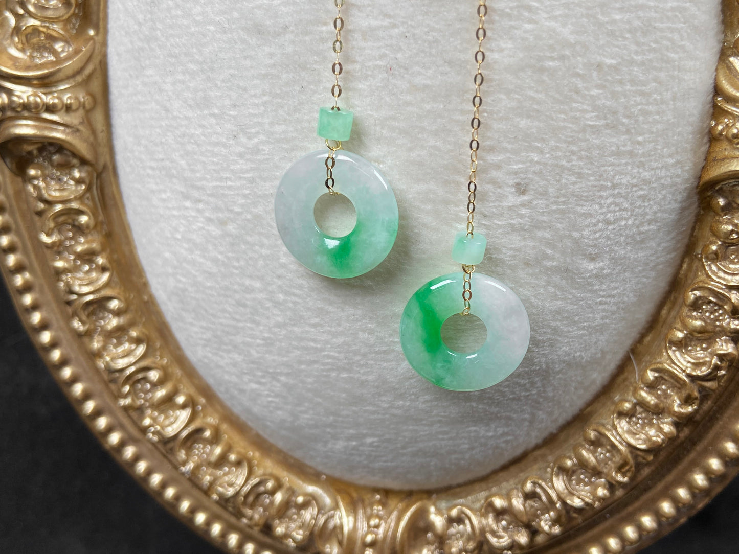 A milky white green cloud donut jadeite earring.