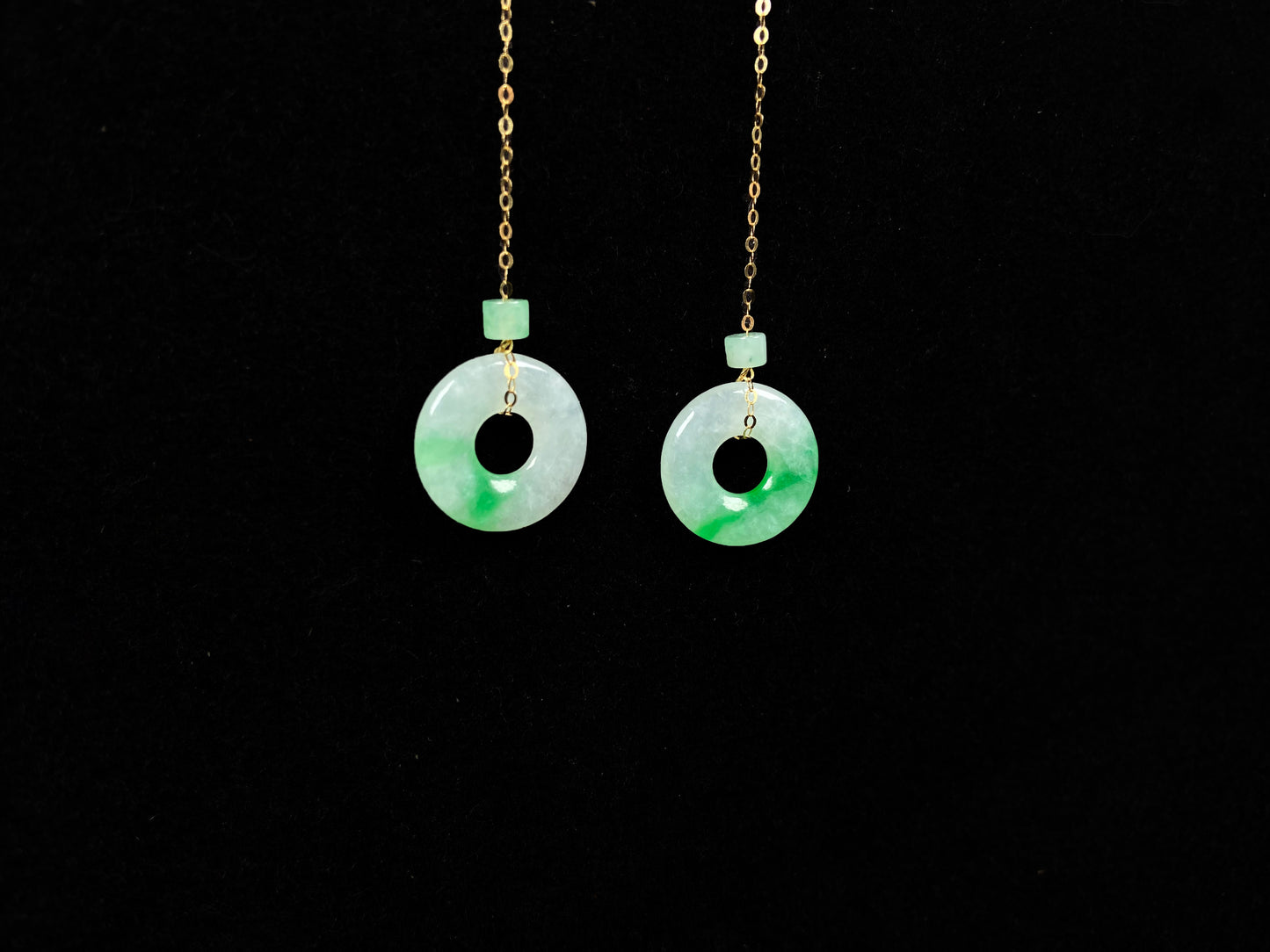 A milky white green cloud donut jadeite earring.