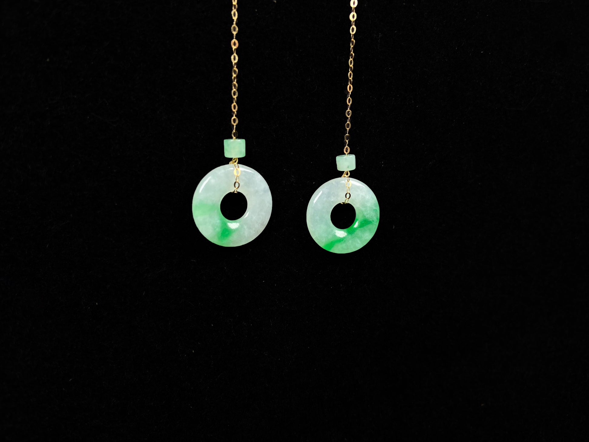 A milky white green cloud donut jadeite earring.