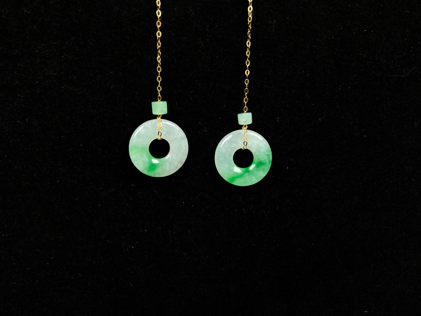 A milky white green cloud donut jadeite earring.