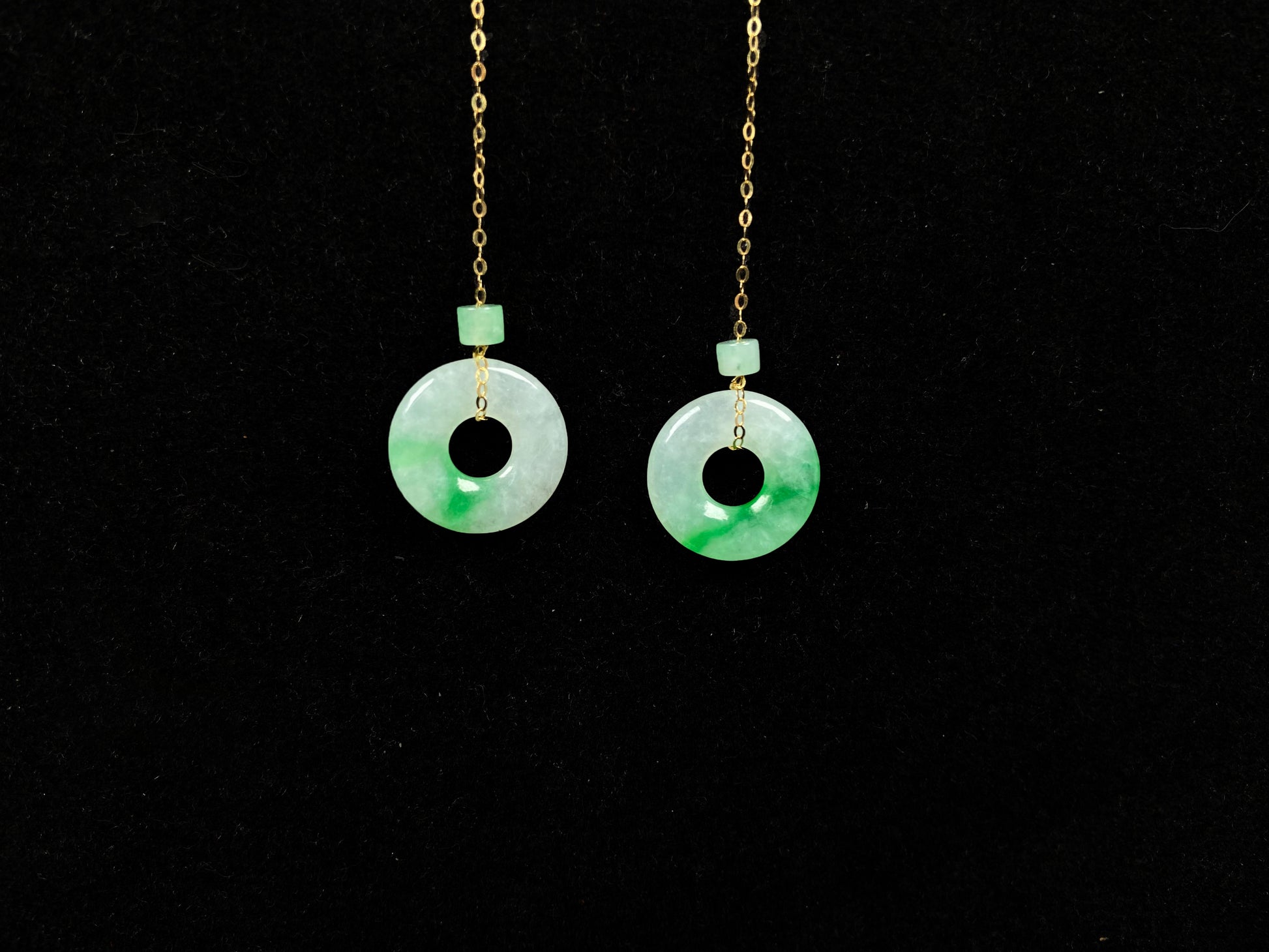 A milky white green cloud donut jadeite earring.