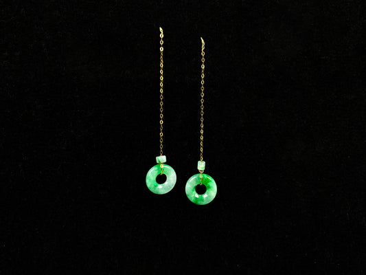 A green dew donut and cylinder jadeite earring.