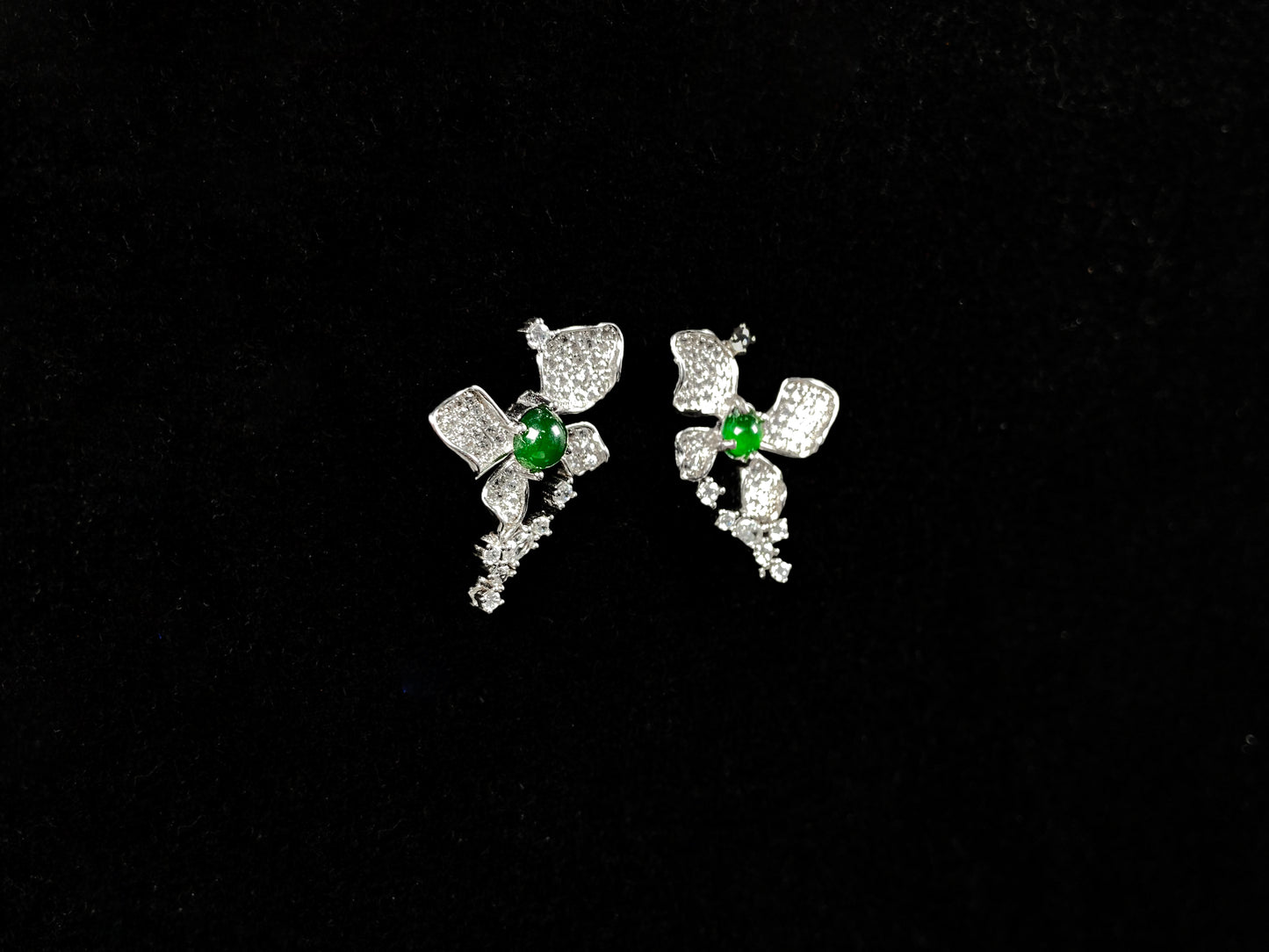 A pair of sparkling petal green core jadeite earrings.