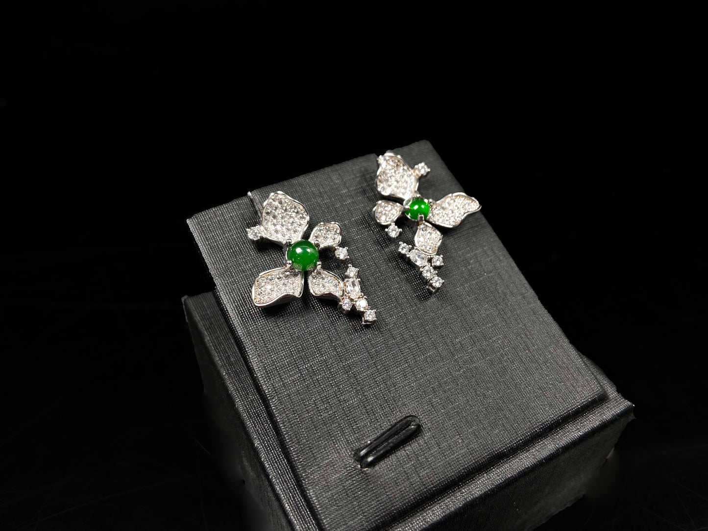 A pair of sparkling petal green core jadeite earrings.