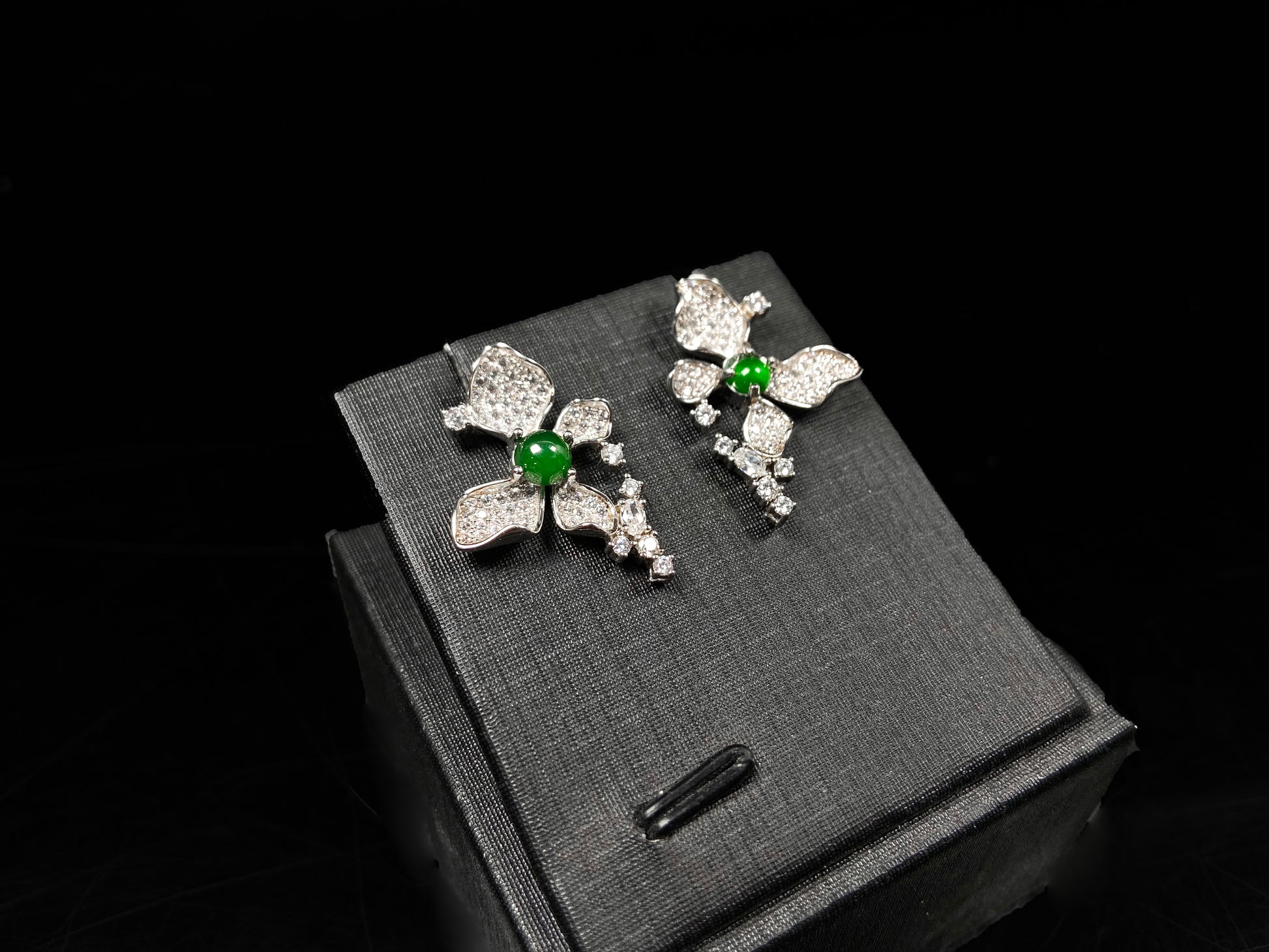 A pair of sparkling petal green core jadeite earrings.