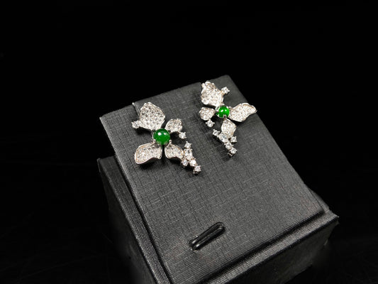 A pair of sparkling petal green core jadeite earrings.