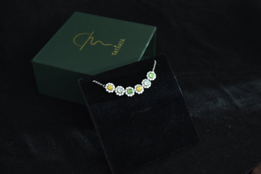 Inspired by the ancient wisdom of the Five Elements, this elegant necklace features five natural Burmese jadeite cabochons in a vibrant palette of yellow, white, green, sky-blue, and clear water tones — each representing one of the elemental energies: Metal, Wood, Water, Fire, and Earth.
