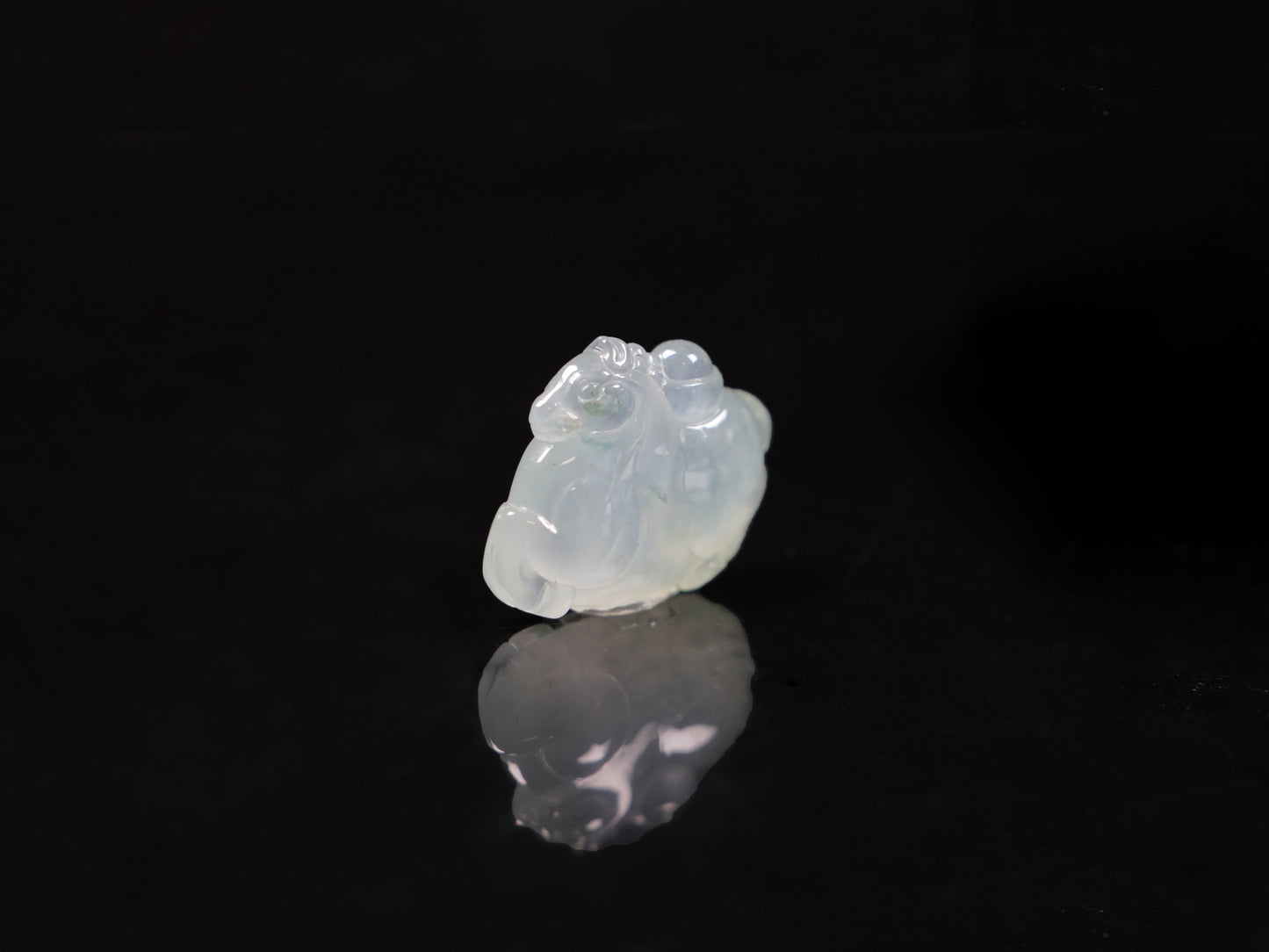 A icy translucent white horse loose jadeite.