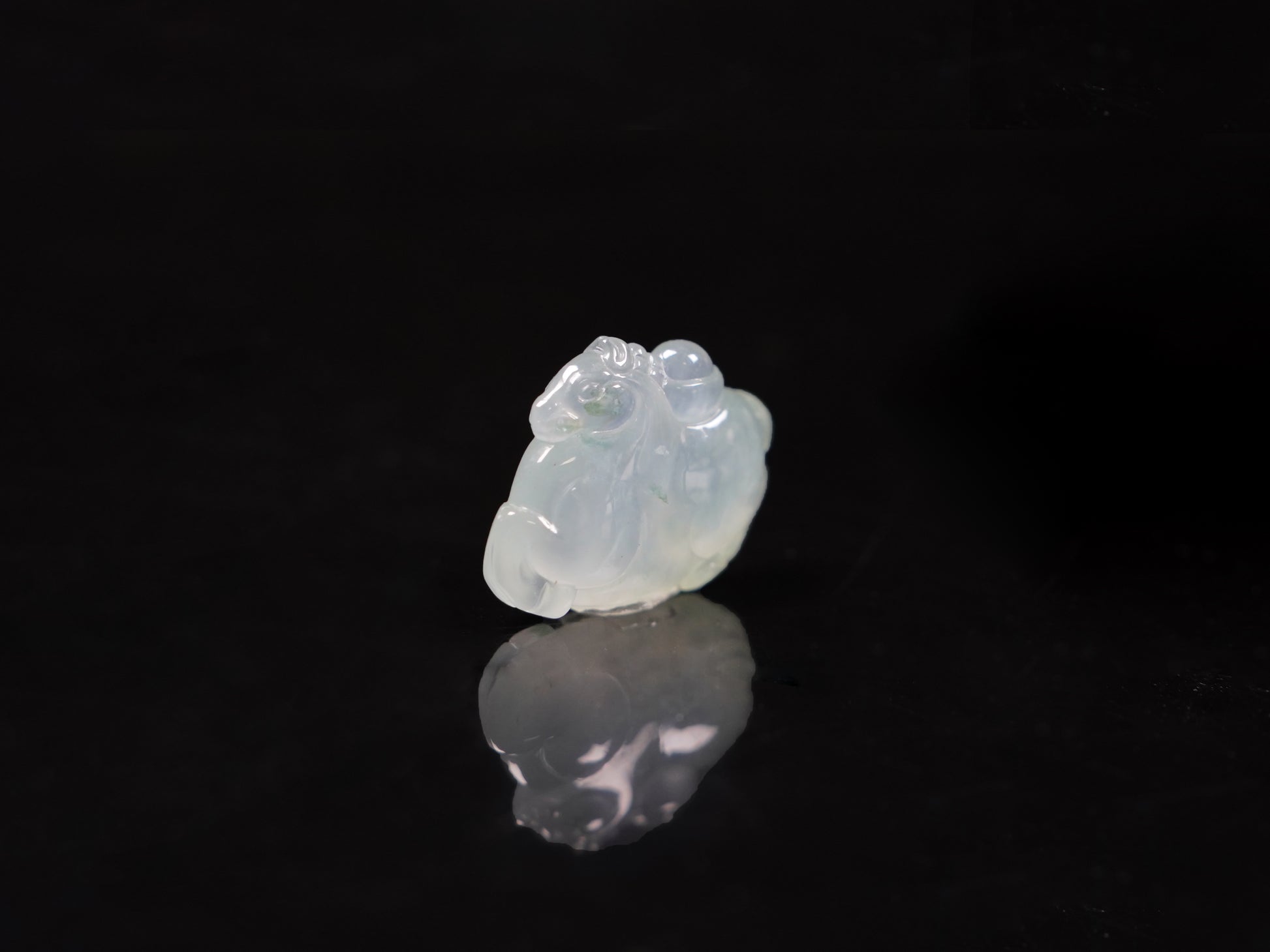 A icy translucent white horse loose jadeite.